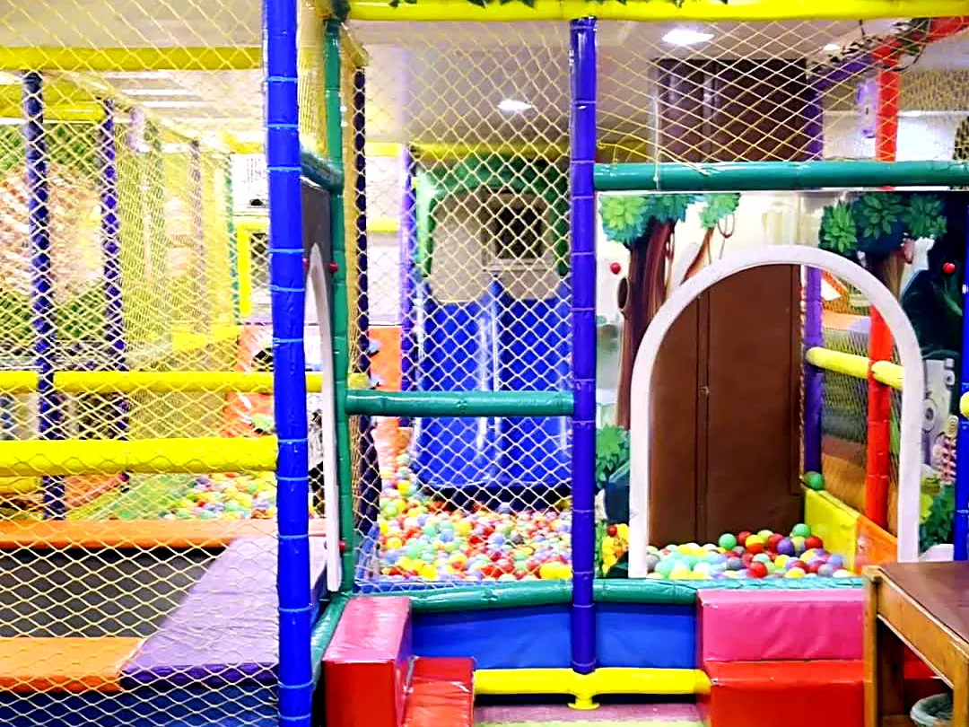 Bright blue, yellow and green soft play frame at Yey Kidzarea