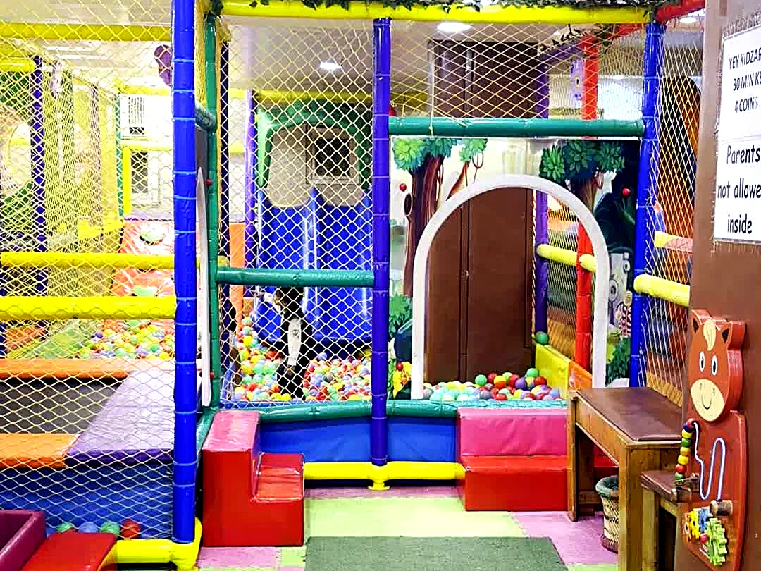 Multi-level soft play climbing frame with nets and tunnels at Yey Kidzarea