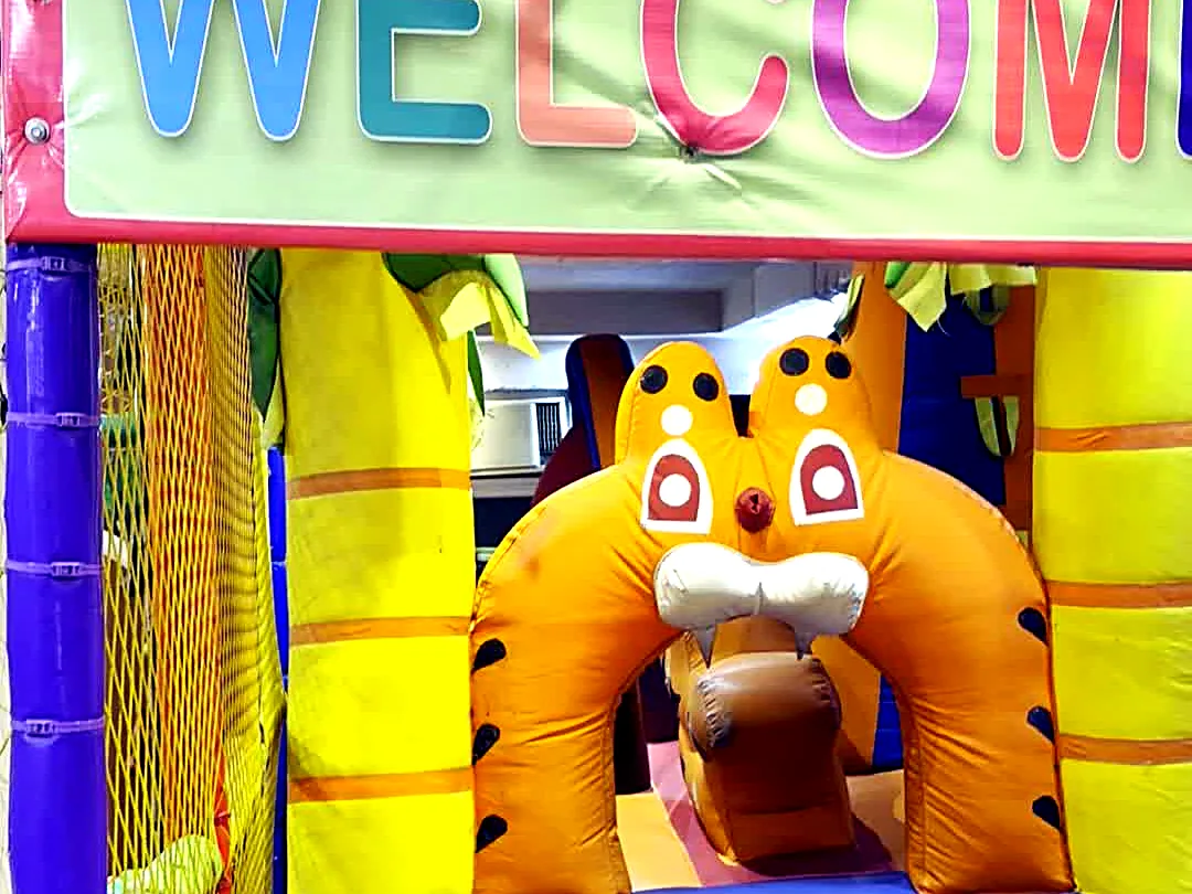 Tiger-themed inflatable bouncy castle under a Welcome banner at Yey Kidzarea