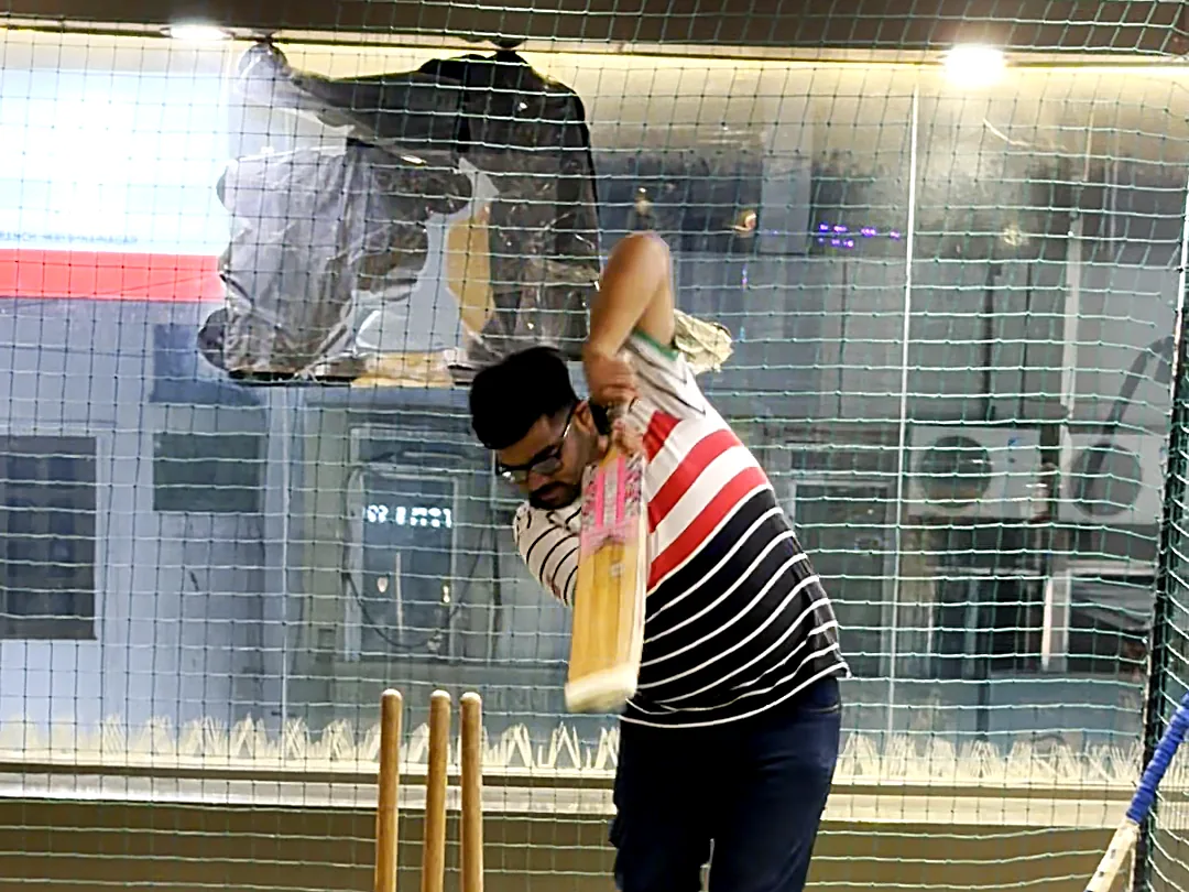 Playing a shot in the indoor cricket net zone at Yey Kidzarea
