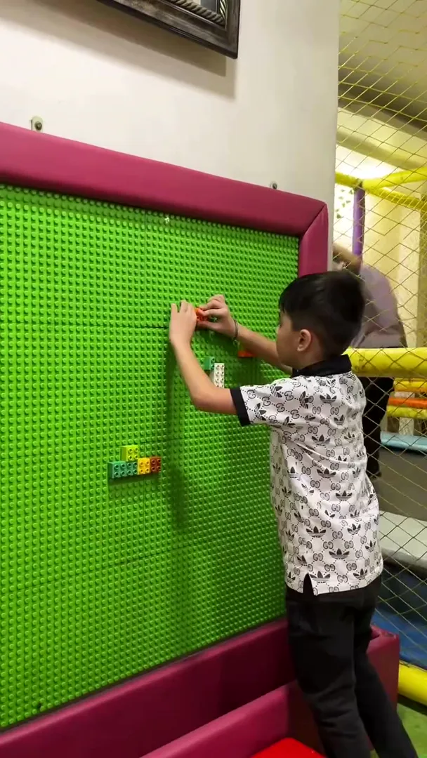 Child on the climbing wall at Yey Kidzarea