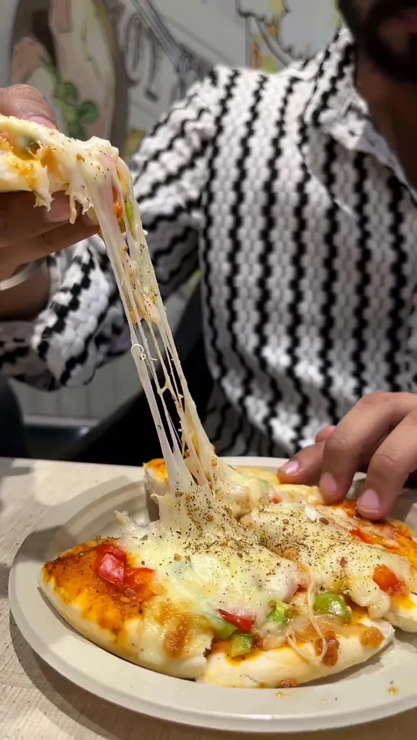 Cheesy pizza fresh from the Yey Kidzarea café