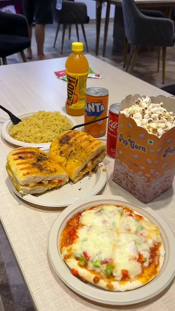 Pizza and popcorn served at the café inside Yey Kidzarea